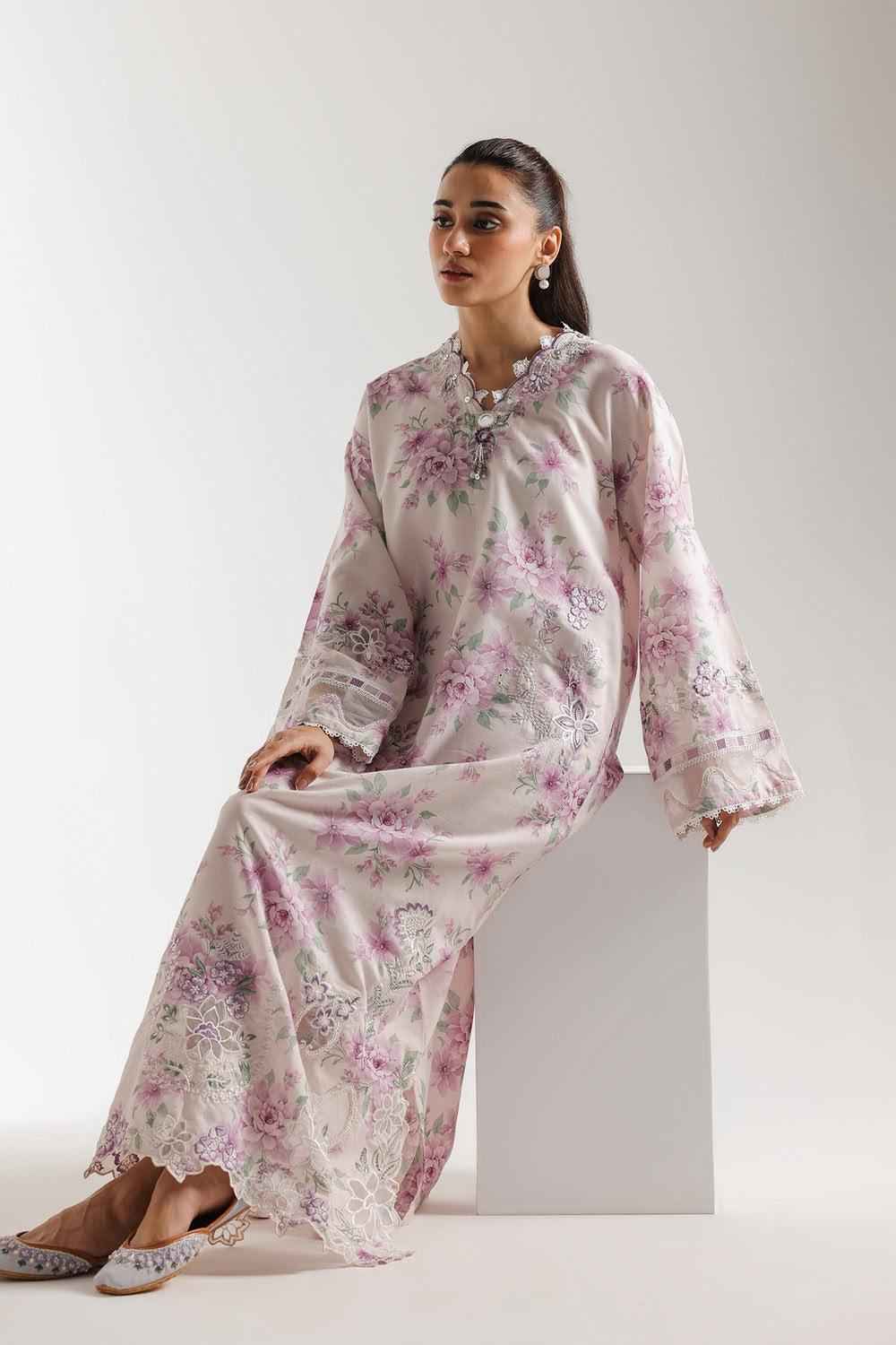 Printed silk frock with gorgeous embroidery, shown full length to display the print and elegant silhouette.